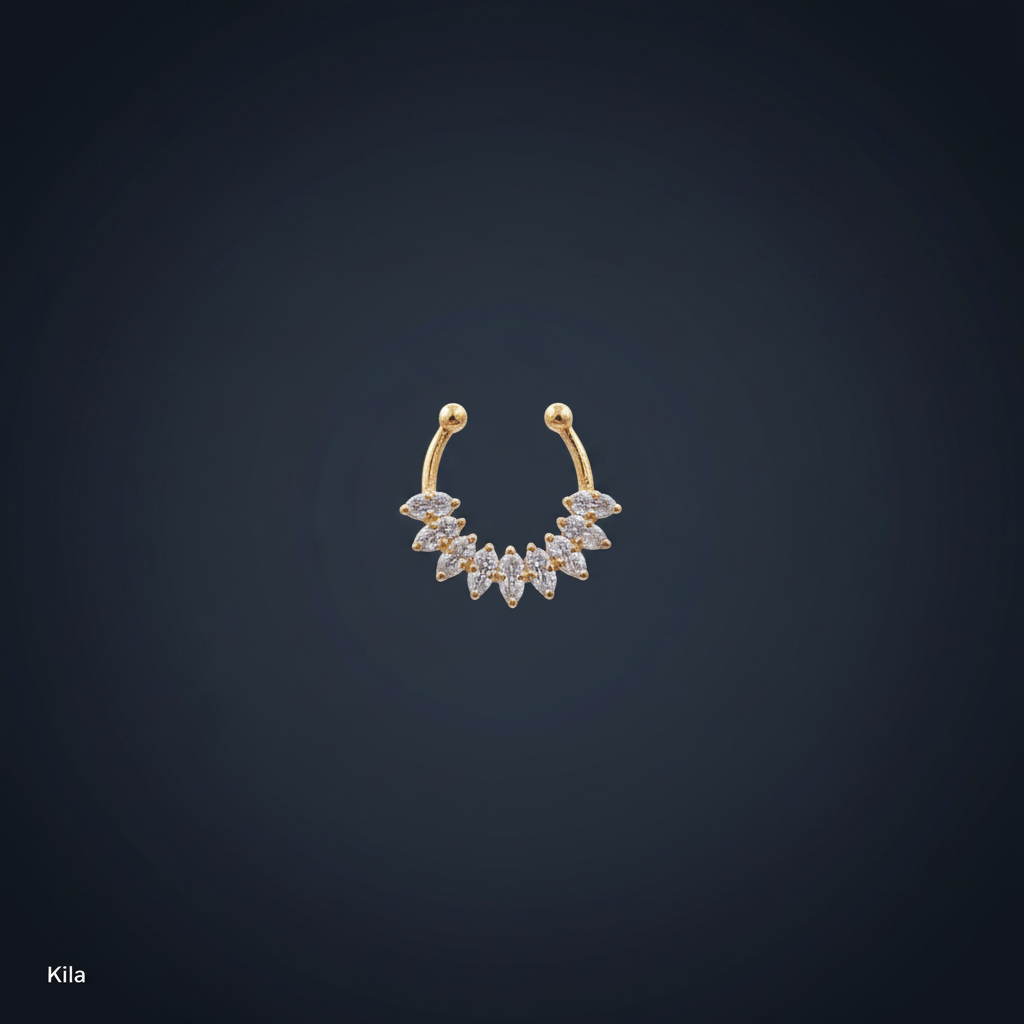 Gold and diamond earring on a person's earlobe with a blue background