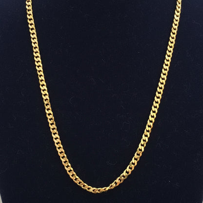 Gold chain on a red fabric background