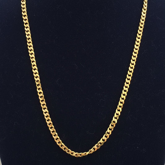 Gold chain on a red fabric background