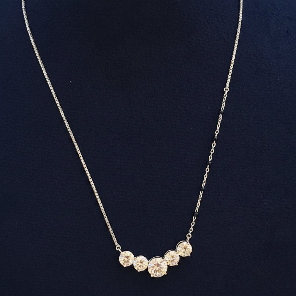 Necklace with floral pendants on a red fabric background