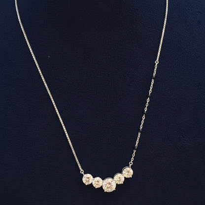 Necklace with floral pendants on a red fabric background