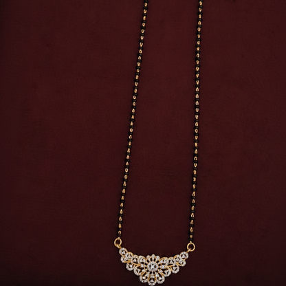 Necklace with a floral clasp on a pink background
