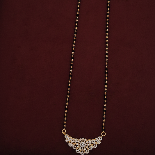 Necklace with a floral clasp on a pink background