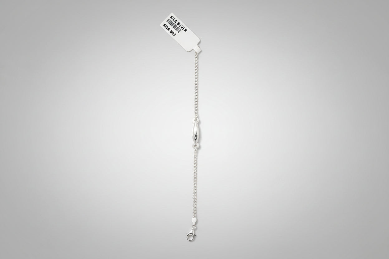 Silver bracelet on a teal fabric background