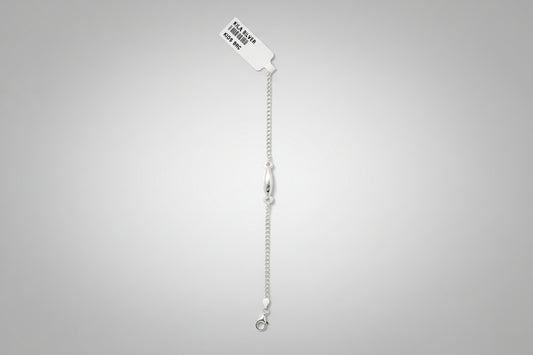 Silver bracelet on a teal fabric background