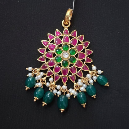 Decorative hair accessory with gemstones on a maroon background