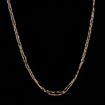 Gold chain on a red fabric background
