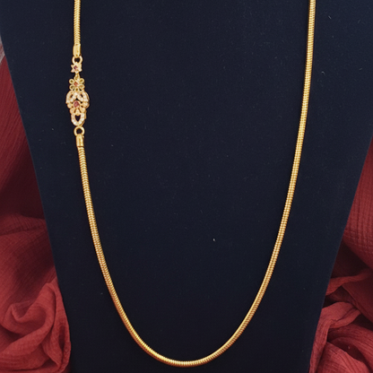 Gold bracelet on a red fabric background