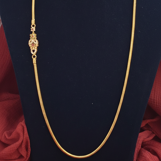 Gold bracelet on a red fabric background
