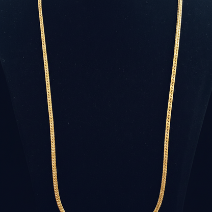 Red fabric with gold zipper on a red background