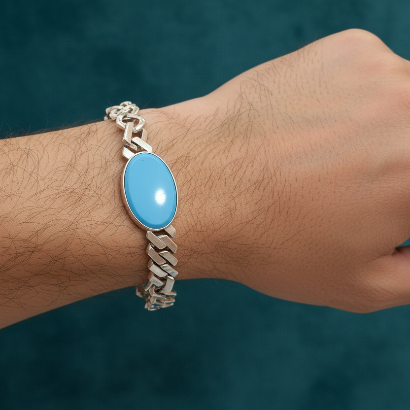 Bracelet with a blue stone on a wrist against a dark background