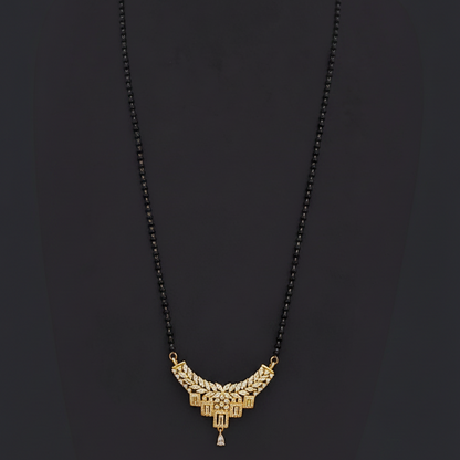 Gold necklace on a mannequin with a red background