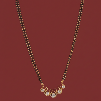 Gold chain necklace on a mannequin with a pink background