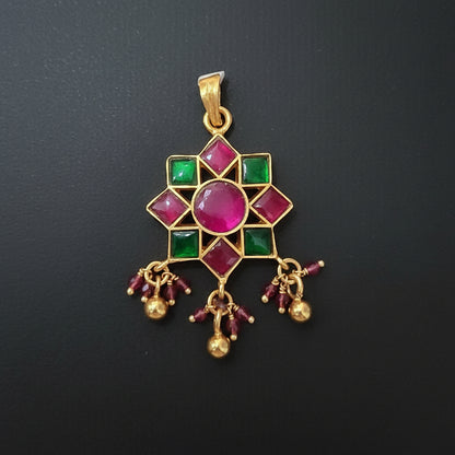 Decorative earring with gemstones on a maroon background