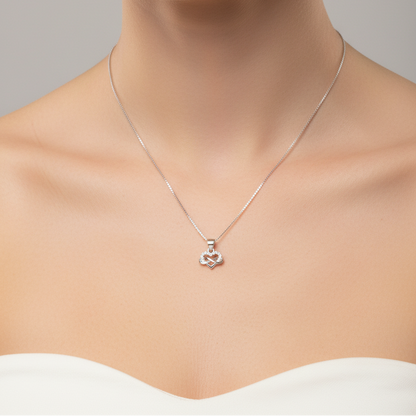 Necklace with a pendant worn by a model on a neutral background