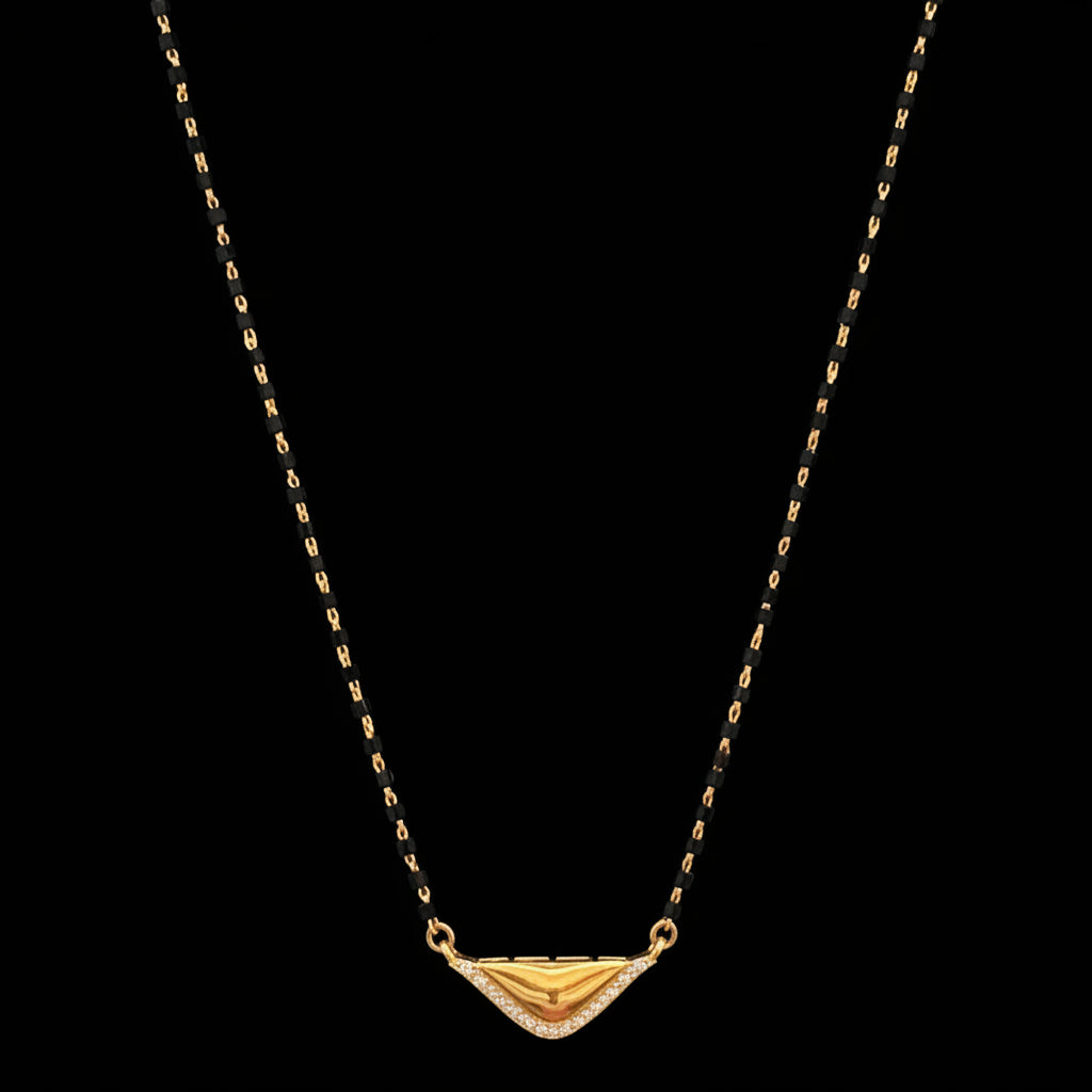 Gold necklace on a red fabric background