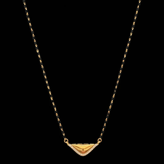 Gold necklace on a red fabric background