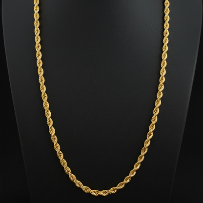 Gold rope chain on a red fabric background