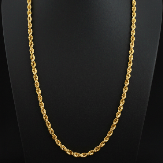 Gold rope chain on a red fabric background