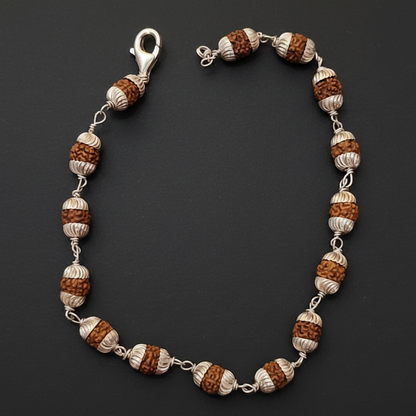 Bracelet with brown and white beads on a blue textured background