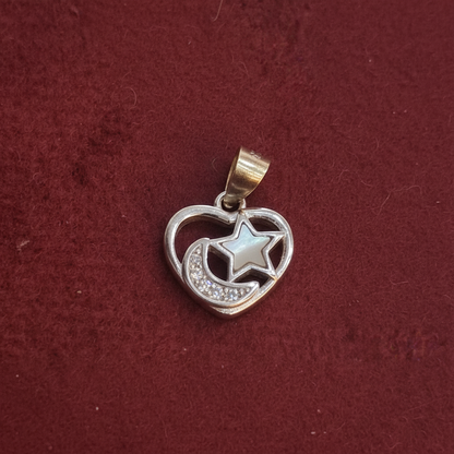 Silver charm with 'Kila Silver' tag on a red background