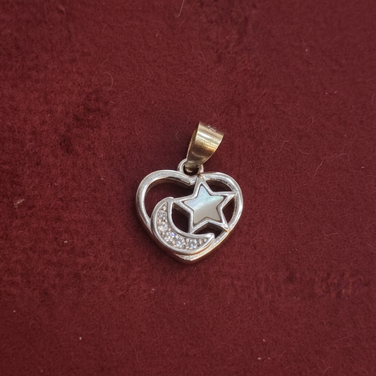 Silver charm with 'Kila Silver' tag on a red background