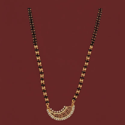 Gold necklace on a red cushion