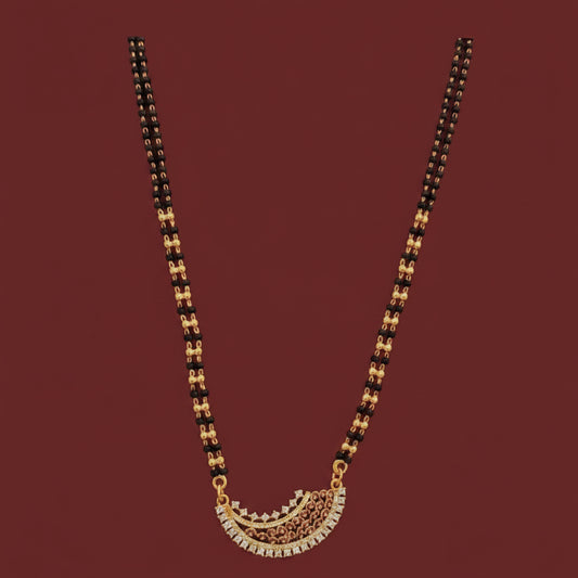 Gold necklace on a red cushion