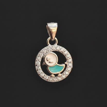 Jewelry pendant on a finger with a blurred background