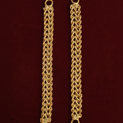 Gold chain necklace on a red background
