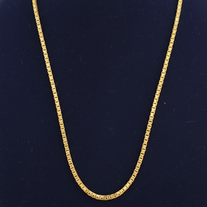 Red fabric with a gold chain detail