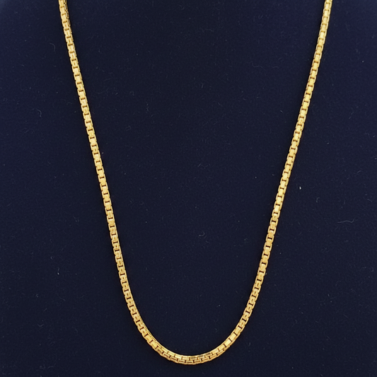 Red fabric with a gold chain detail
