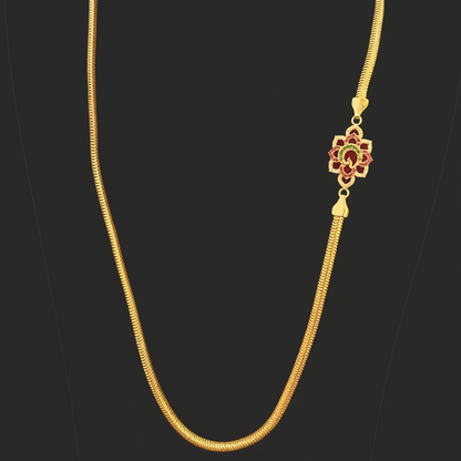 Gold necklace on a red fabric background