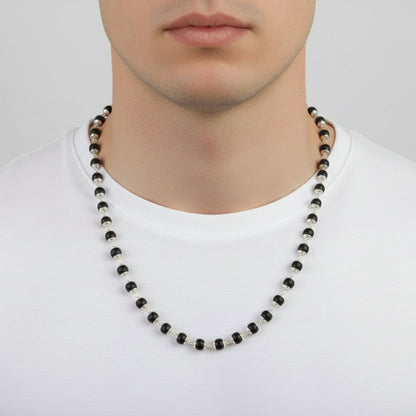 Necklace with green beads on a red surface