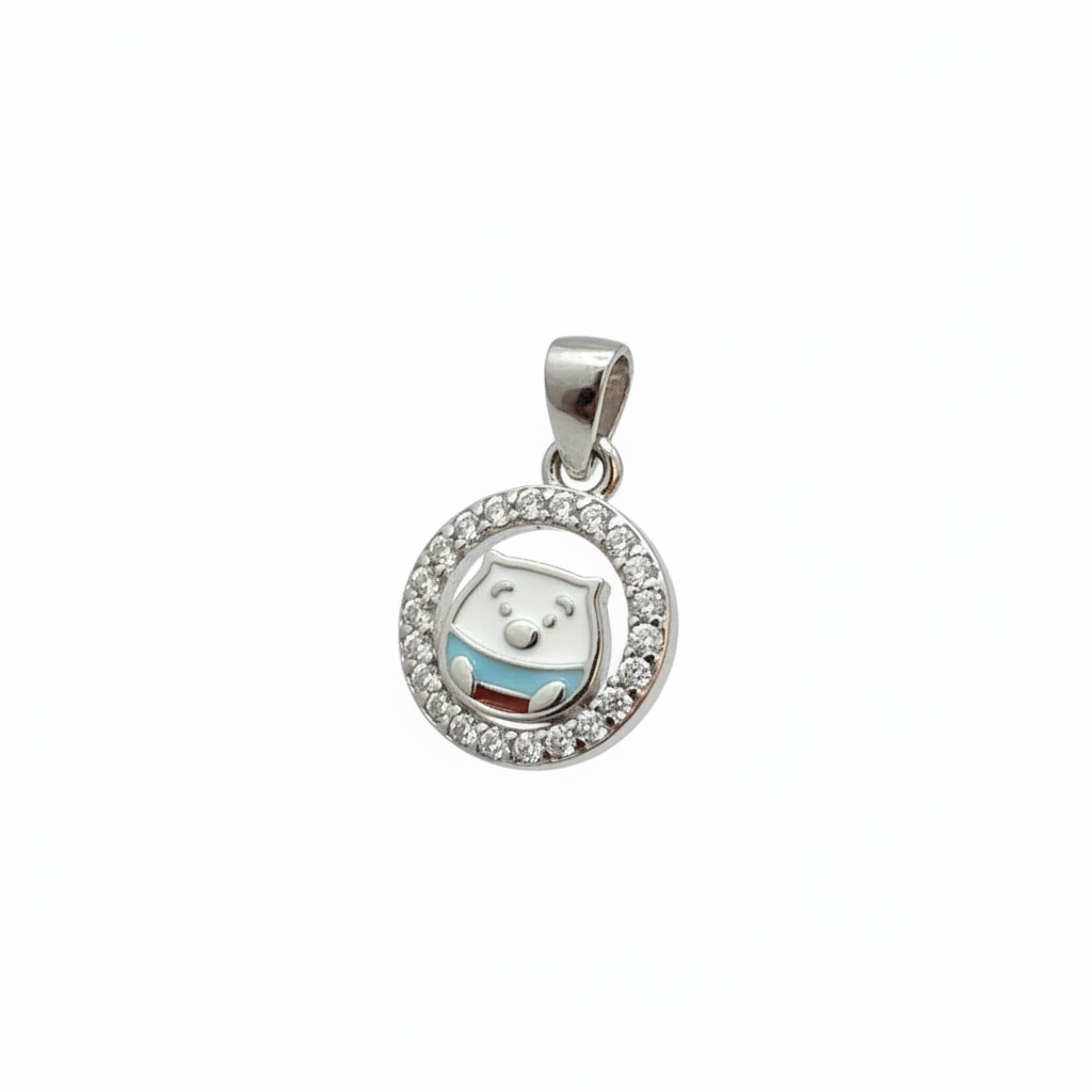 Close-up of a silver ring with a circular pendant on a person's finger.