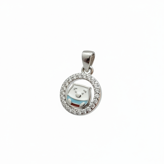 Close-up of a silver ring with a circular pendant on a person's finger.