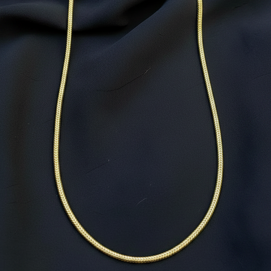 Red fabric with a gold cord on a red background