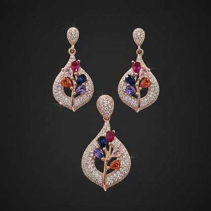 Two diamond earrings held between fingers against a red fabric background