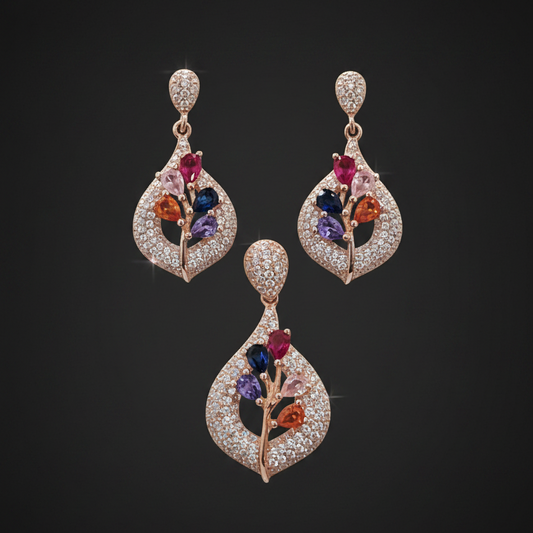 Two diamond earrings held between fingers against a red fabric background
