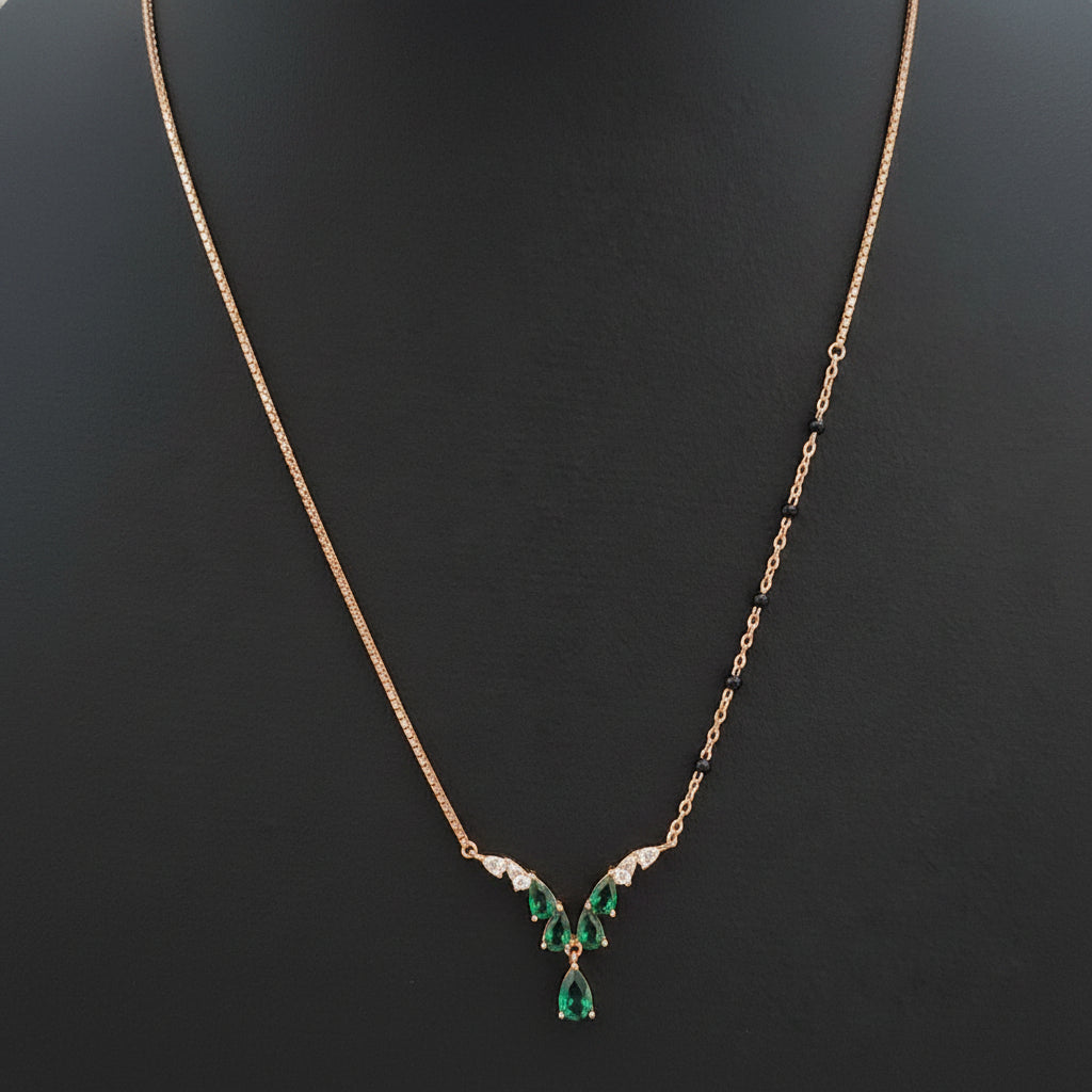 Necklace with a green pendant on a red fabric background