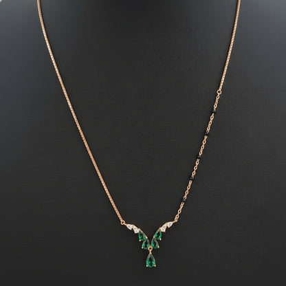 Necklace with a green pendant on a red fabric background