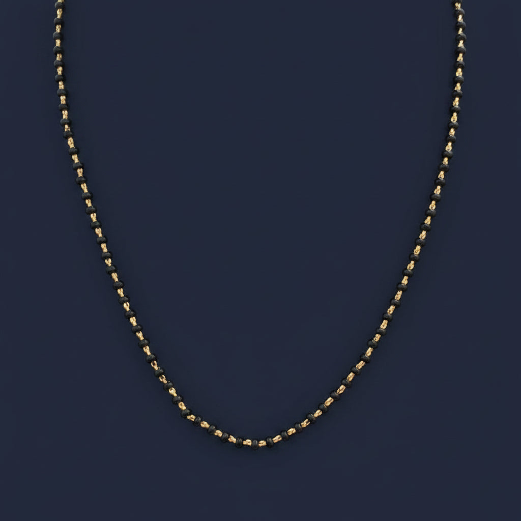 Close-up of a red garment with a chain detail on a blurred background