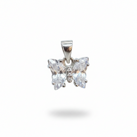 Silver butterfly earrings on a person's hand with a blurred background