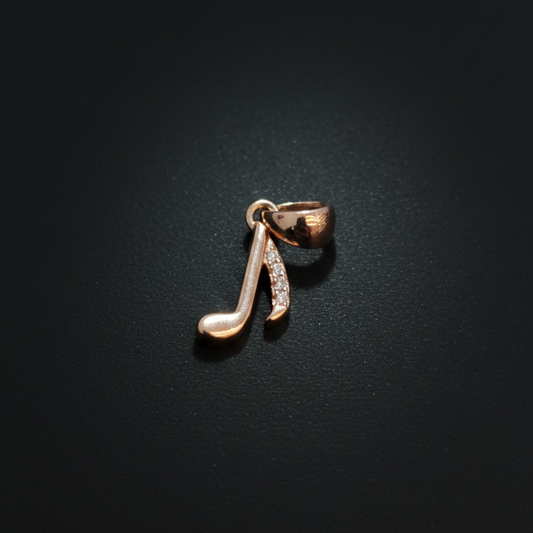 Rose gold earring on a person's ear